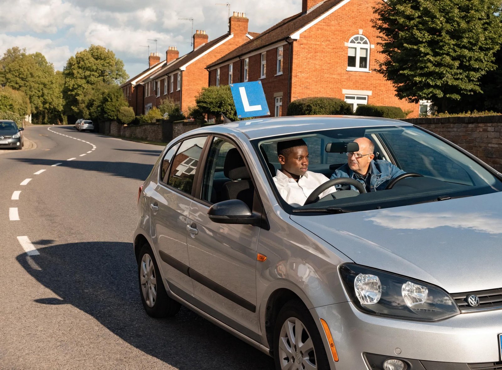 Learner driver practicing driving maneuvers with an instructor, focused on test preparation
