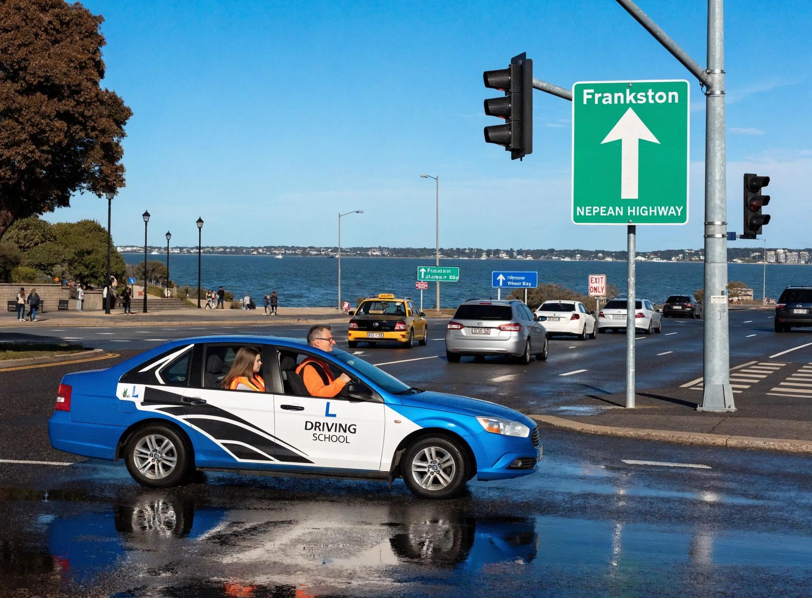 Learner driver practicing on Nepean Highway with Frankston Waterfront in the background