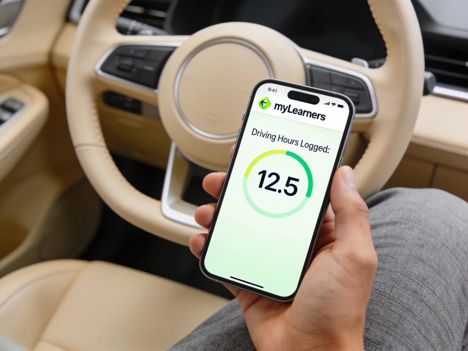 Close-up of a hand using the myLearners app inside a car, showcasing digital logging of driving hours