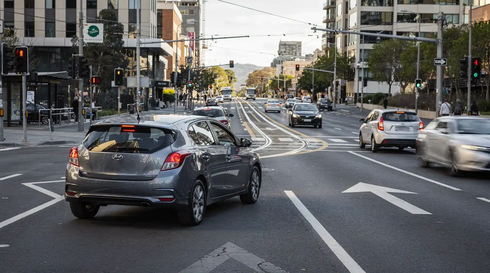 Driving in Melbourne brings unique challenges, particularly around understanding hook turns and tram rules together